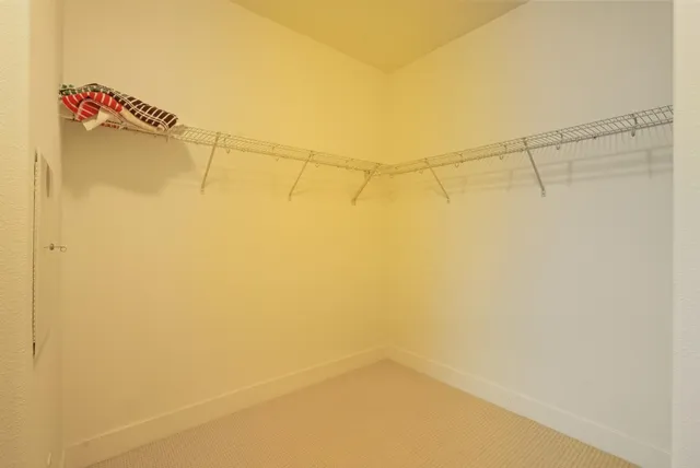 a bathroom with a shower a toilet and a sink