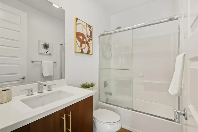 a bathroom with a double vanity sink a mirror and a shower