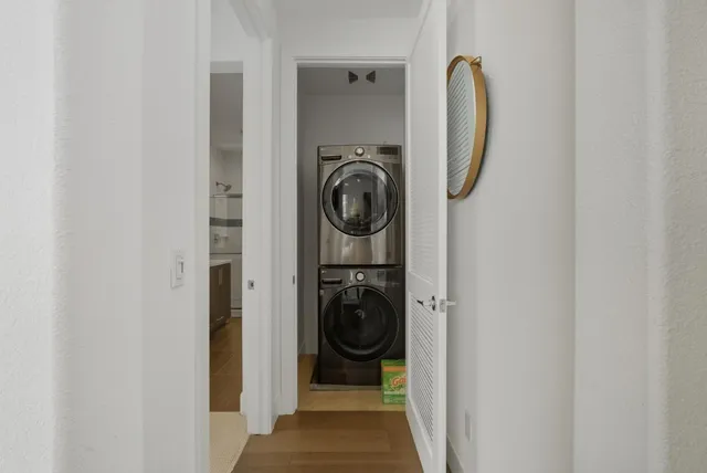 a view of an outside dining space with a table and chairs
