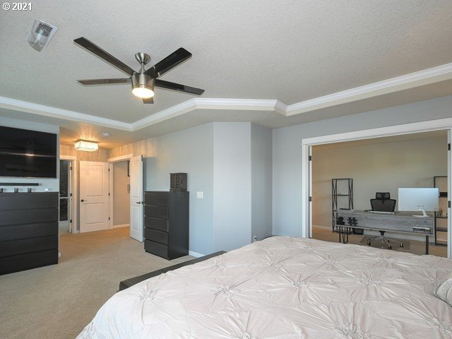 1663 South 14th Circle Ridgefield, WA 98642 - Photo 13 of 29 a bedroom with a bed and a large mirror on the dresser