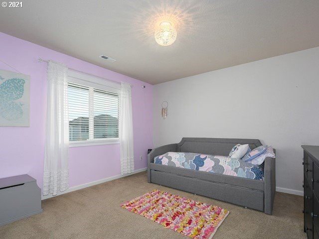 1663 South 14th Circle Ridgefield, WA 98642 - Photo 21 of 29 a bedroom with a bed and a window