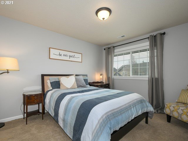 1663 South 14th Circle Ridgefield, WA 98642 - Photo 22 of 29 a bedroom with a bed and a window