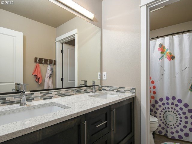 1663 South 14th Circle Ridgefield, WA 98642 - Photo 23 of 29 a bathroom with a sink and a mirror