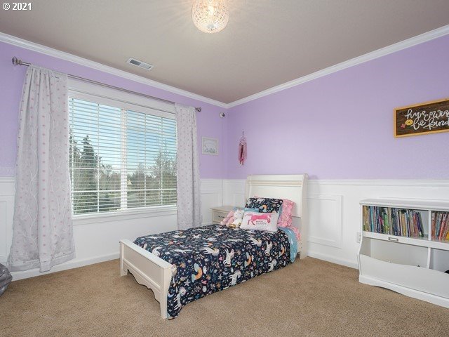 1663 South 14th Circle Ridgefield, WA 98642 - Photo 24 of 29 a bed room with a bed and a book shelf
