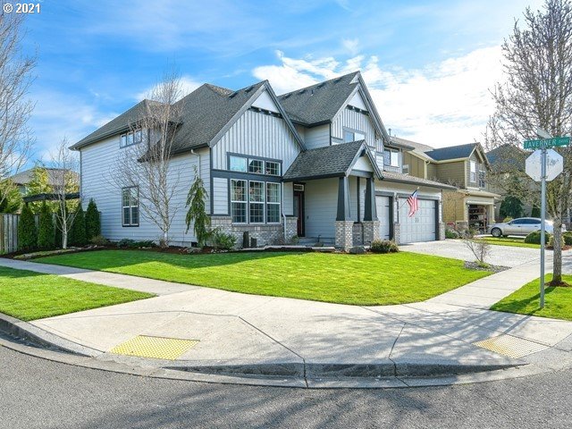 1663 South 14th Circle Ridgefield, WA 98642 - Photo 29 of 29 a view of a white house with a big yard and large trees