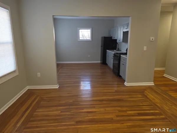 a view of a kitchen from the hallway