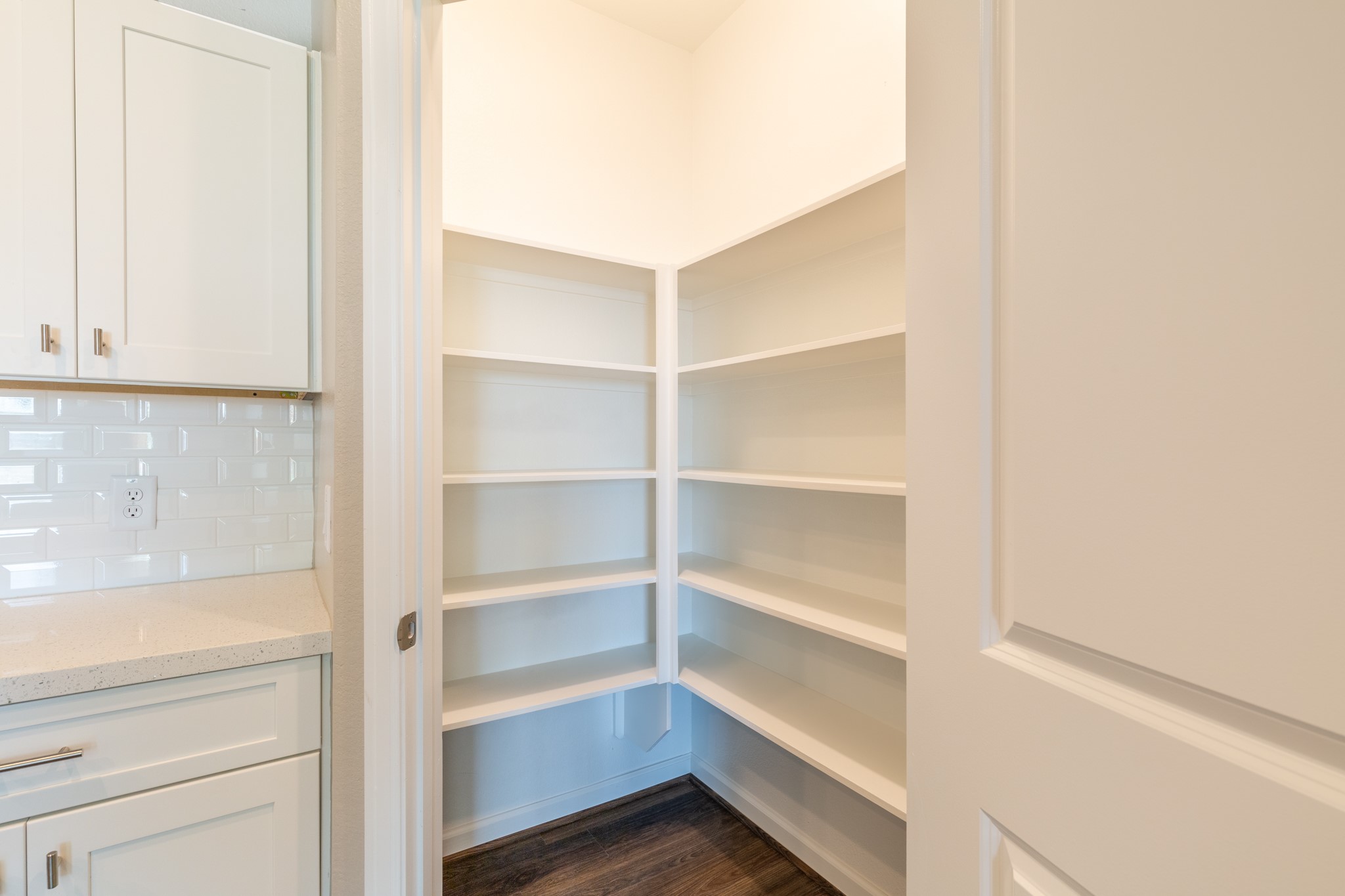 115 Park Place Circle, Unit B Waller, TX 77484 - Photo 11 of 24 a view of walk in closet with empty racks