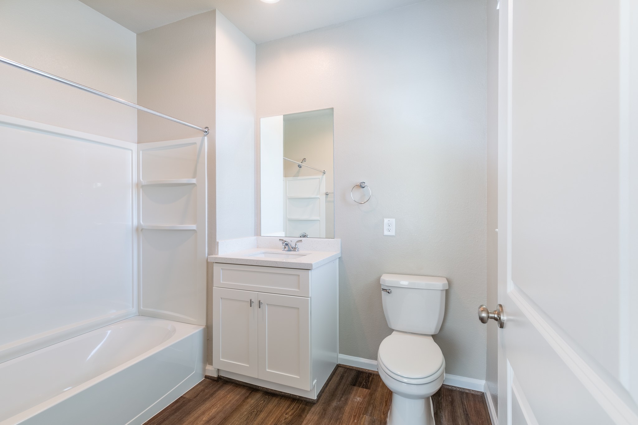 115 Park Place Circle, Unit B Waller, TX 77484 - Photo 16 of 24 a bathroom with a toilet a sink and bathtub