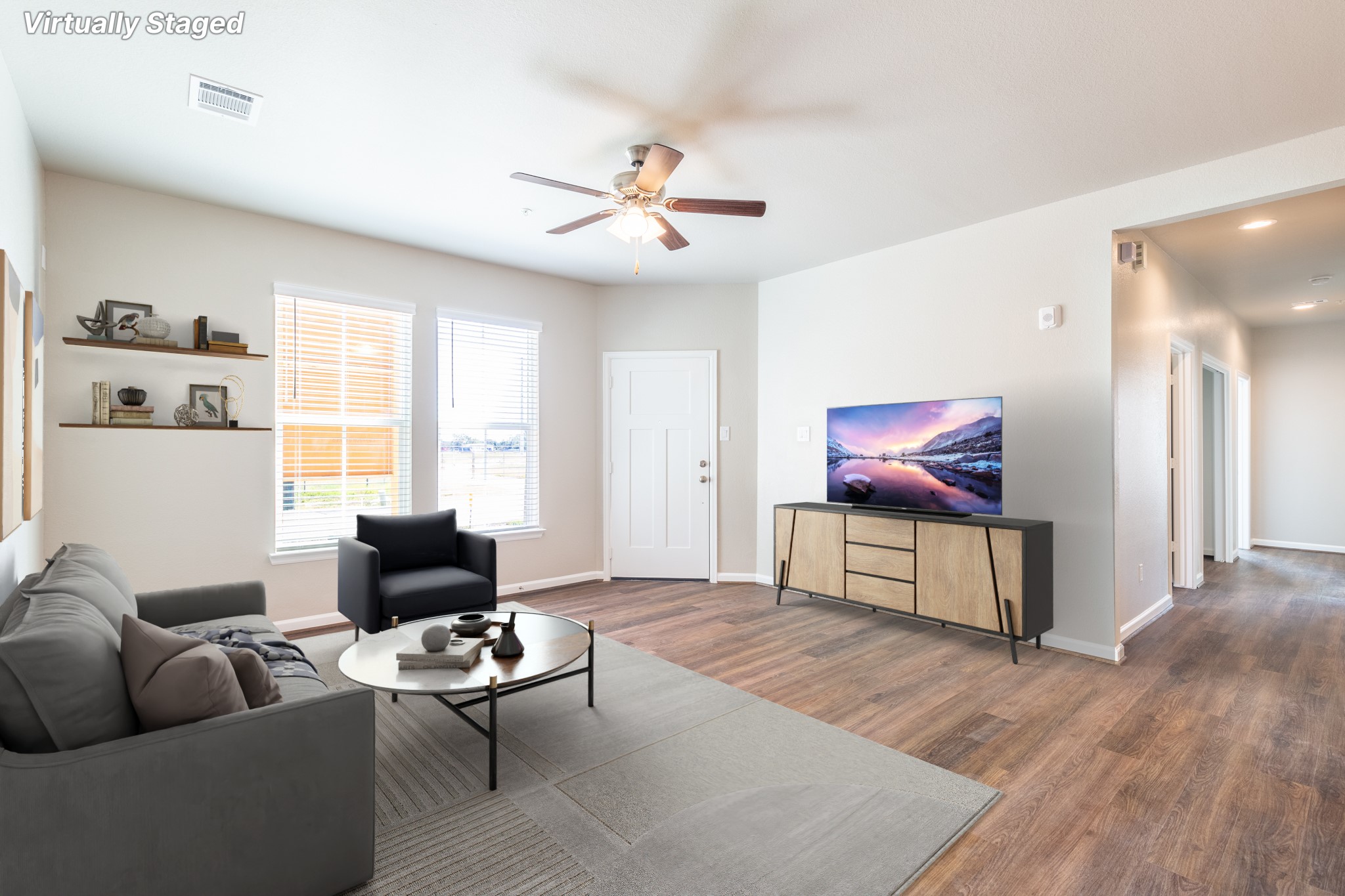 115 Park Place Circle, Unit B Waller, TX 77484 - Photo 8 of 24 a living room with furniture a flat screen tv and a window