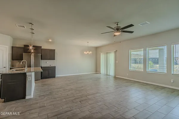 a view of a kitchen with a sink cabinets and wooden floor