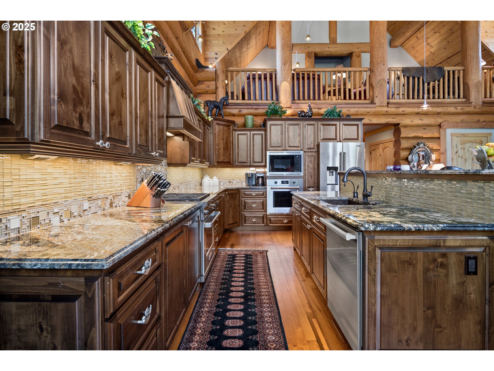 89790 East Morrison Lane Government Camp, OR 97028 - Photo 14 of 48 a kitchen with stainless steel appliances granite countertop a stove a sink dishwasher and cabinets with wooden floor
