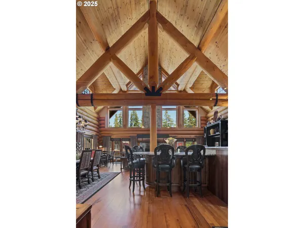 a view of a room with lots of wooden furniture