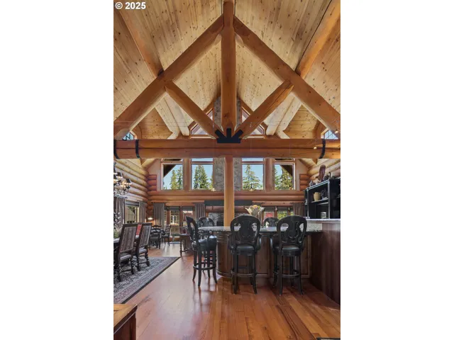 a view of a room with lots of wooden furniture