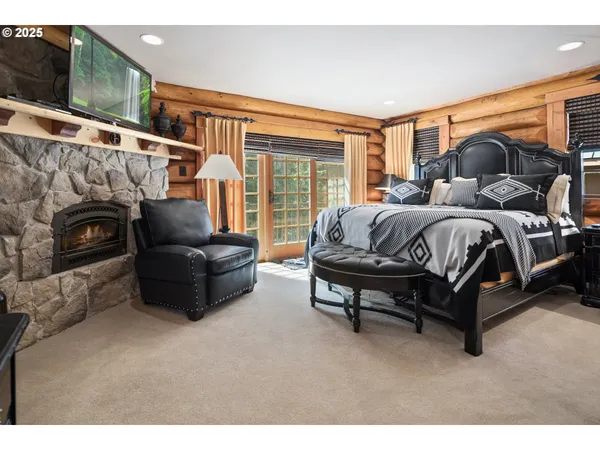 a spacious bedroom with a bed and a couch