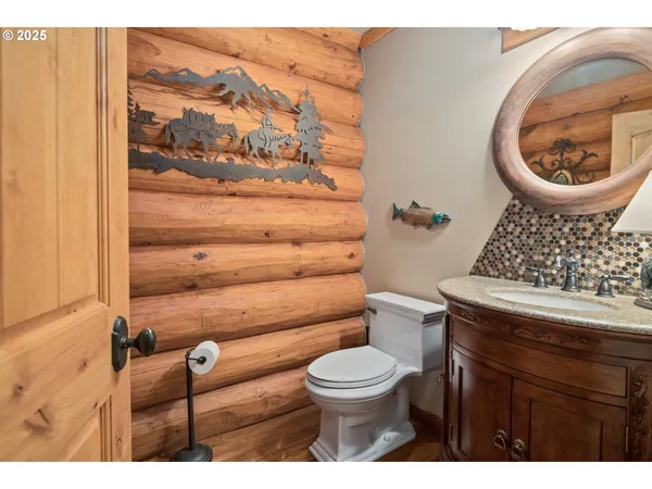a bathroom with a toilet and a vanity