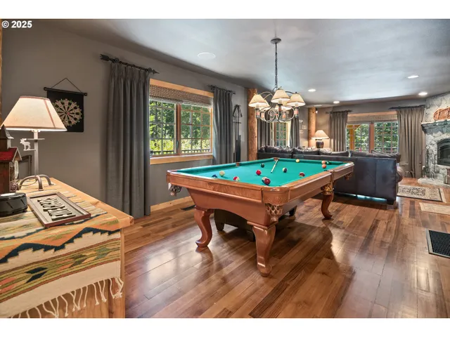 a dining room with a table and chairs