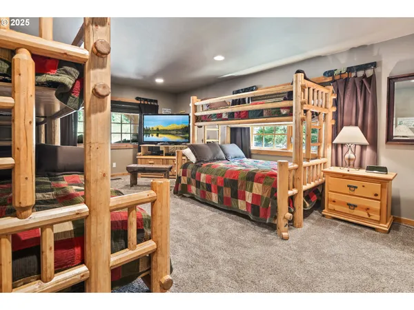a bedroom with furniture and a baby crib