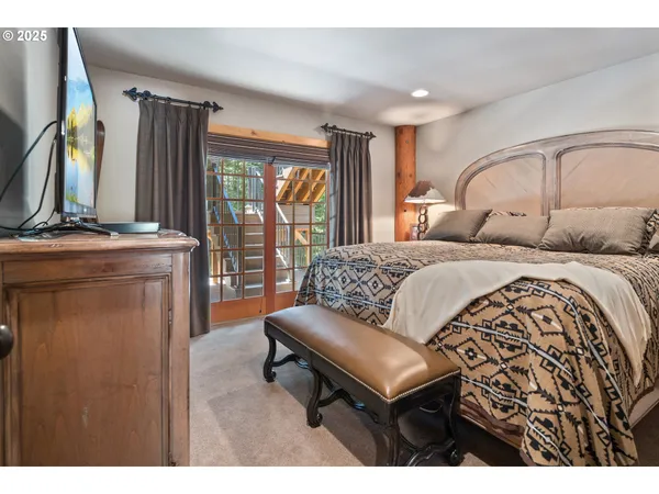 a bedroom with a bed and a couch
