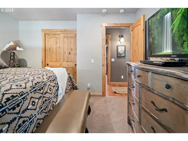 a bedroom with a bed and a dresser