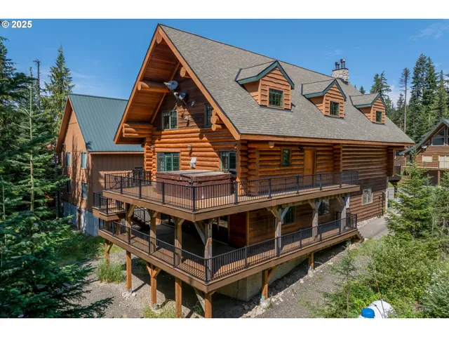 an aerial view of a house with roof deck front of house