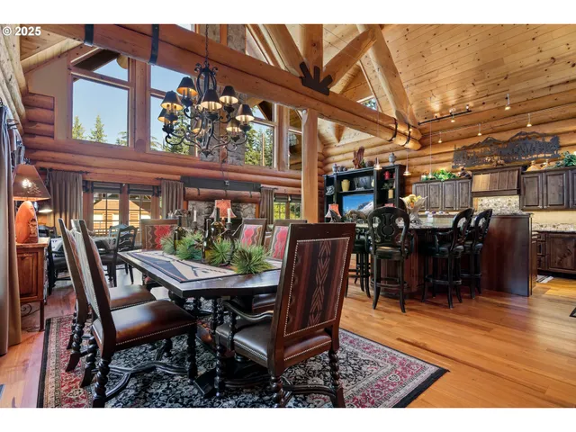 a dining room with a wooden table and chairs