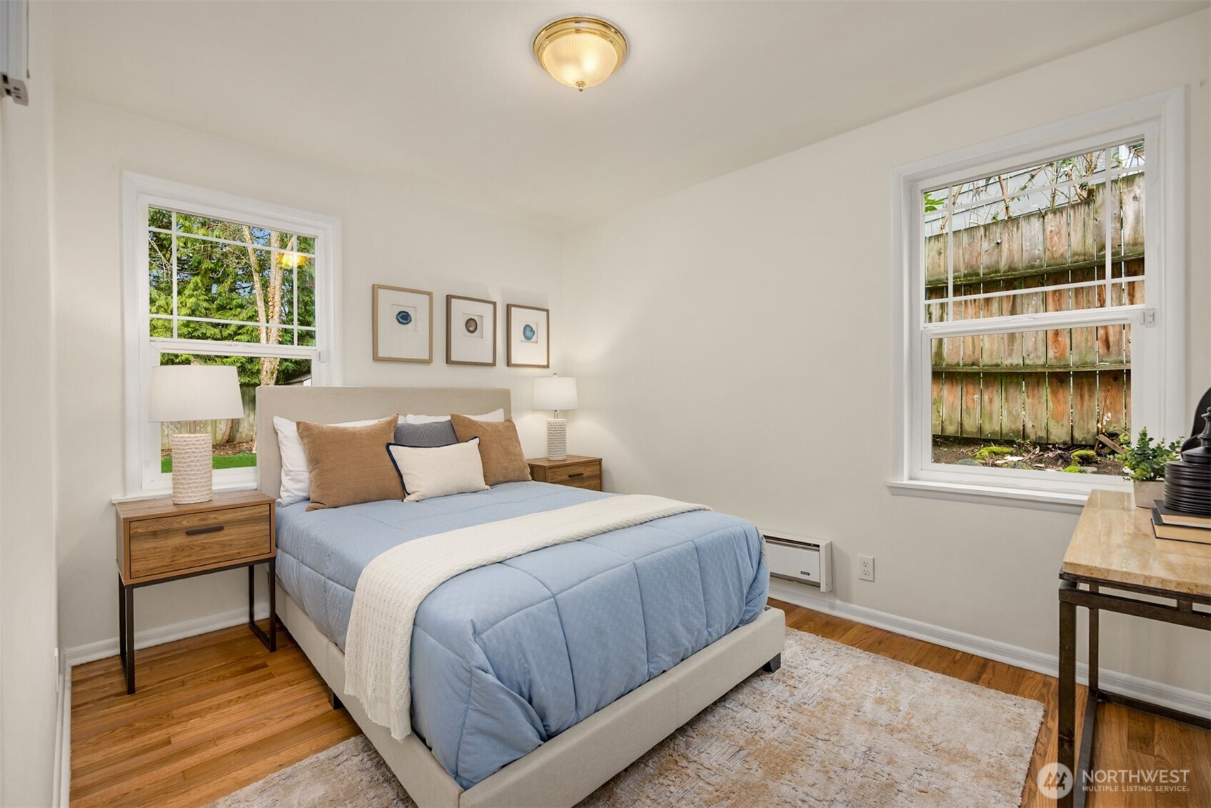5606 Northeast 59th Street Seattle, WA 98105 - Photo 13 of 28 a bedroom with a bed and a window