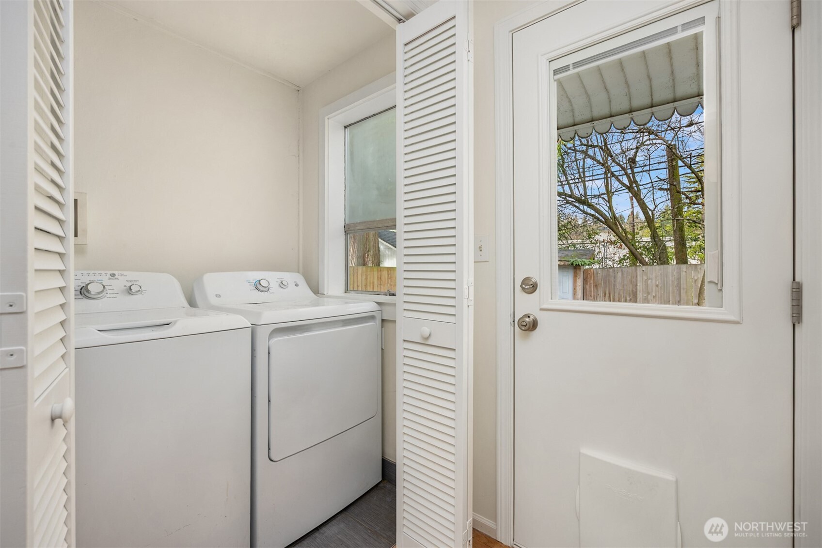 5606 Northeast 59th Street Seattle, WA 98105 - Photo 16 of 28 a utility room with dryer and washer
