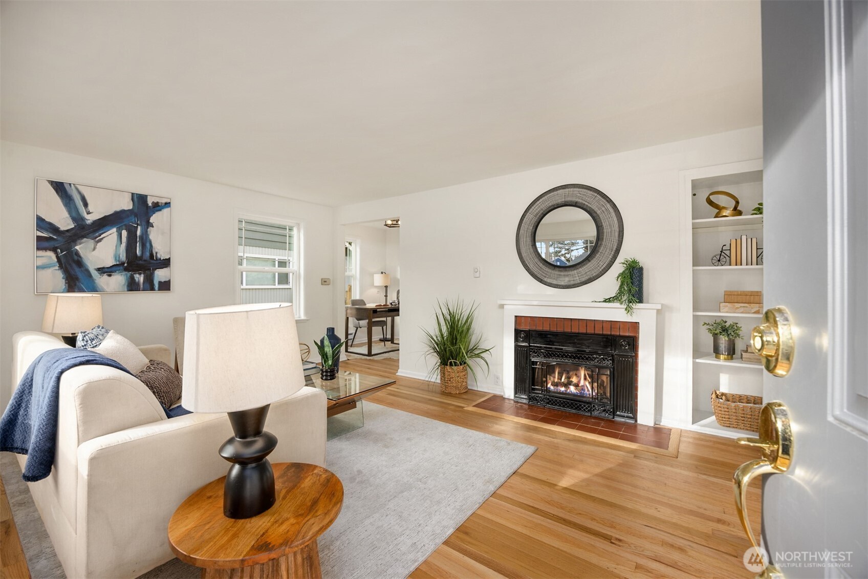 5606 Northeast 59th Street Seattle, WA 98105 - Photo 4 of 28 a living room with furniture a rug and a fireplace