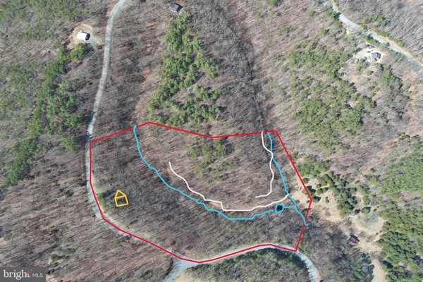 a view of a swimming pool with a yard