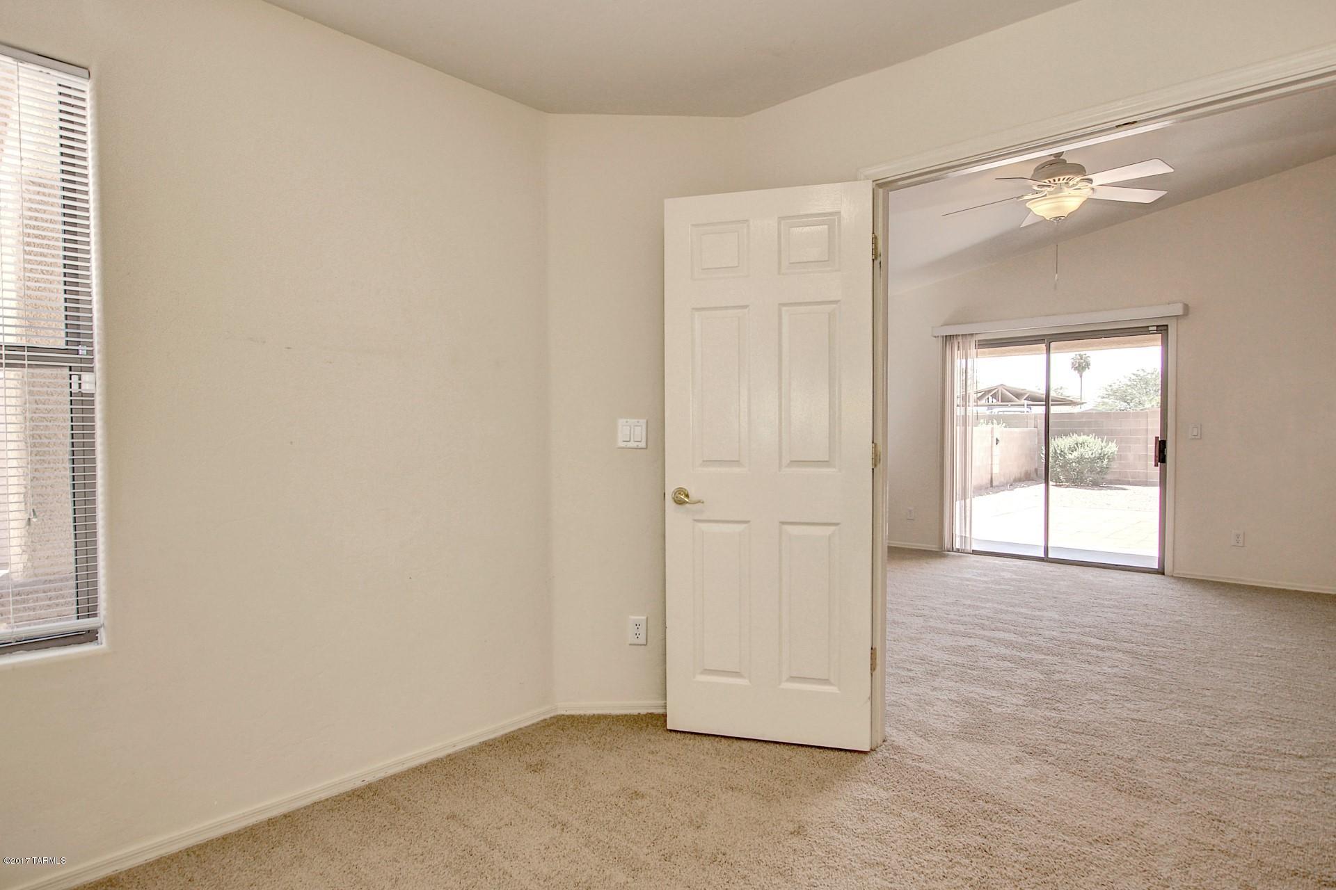 8350 East Bowline Road Tucson, AZ 85710 - Photo 17 of 26 an empty room with windows and closet