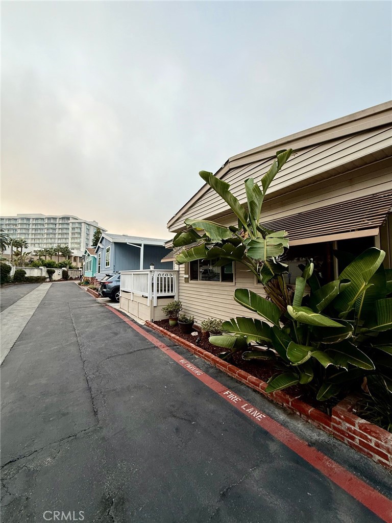 80 Huntington Street, Unit 712 Huntington Beach, CA 92648 - Photo 2 of 12 a car parked on the side of the road