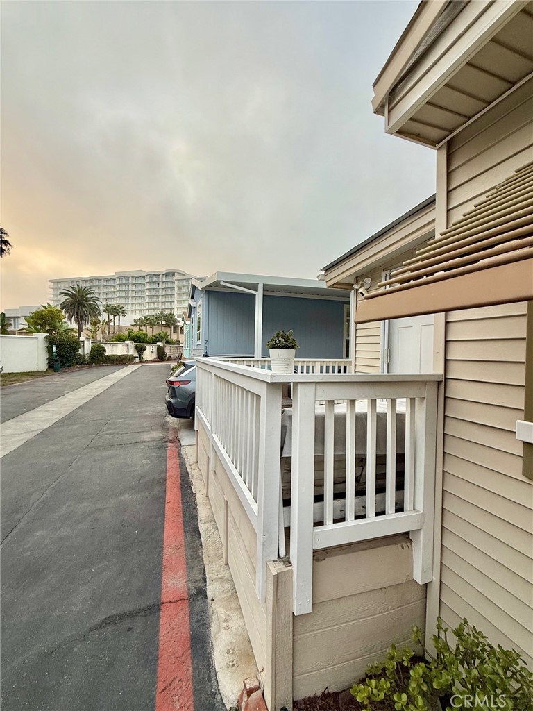 80 Huntington Street, Unit 712 Huntington Beach, CA 92648 - Photo 3 of 12 a view of a balcony with car parked