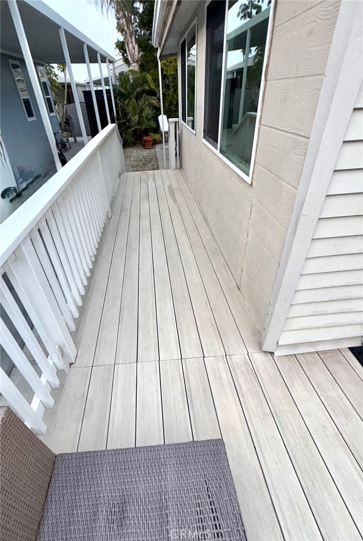 80 Huntington Street, Unit 712 Huntington Beach, CA 92648 - Photo 5 of 12 a view of outdoor space with deck and wooden floor