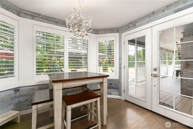 a kitchen that has a table and chairs in it