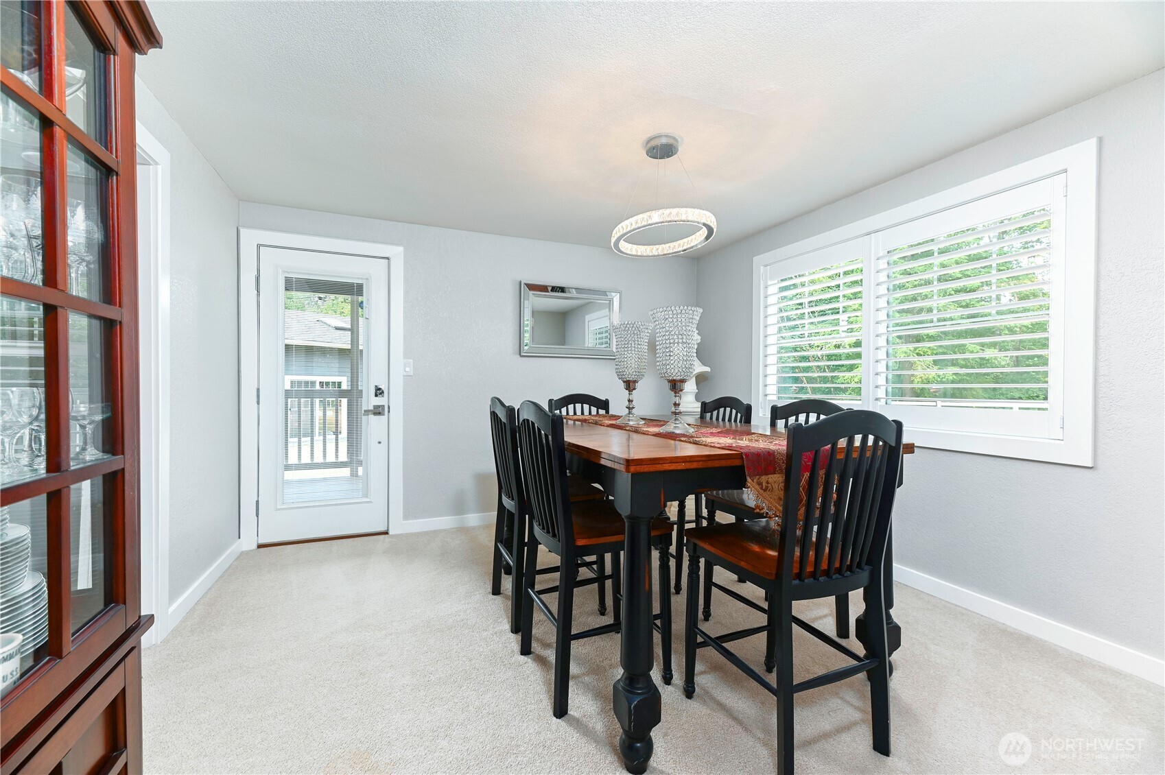 12523 Woods Lake Road Monroe, WA 98272 - Photo 18 of 40 a view of a dining room with furniture and a window
