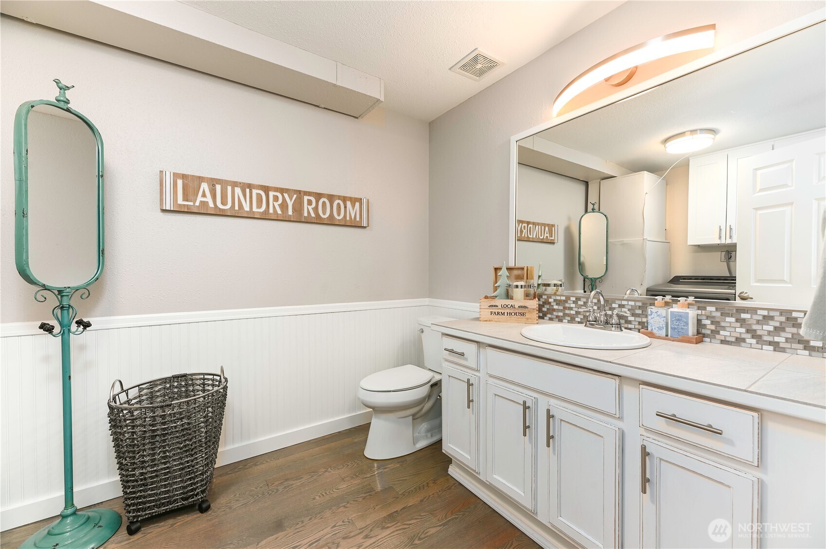 12523 Woods Lake Road Monroe, WA 98272 - Photo 19 of 40 a bathroom with a toilet a sink and mirror