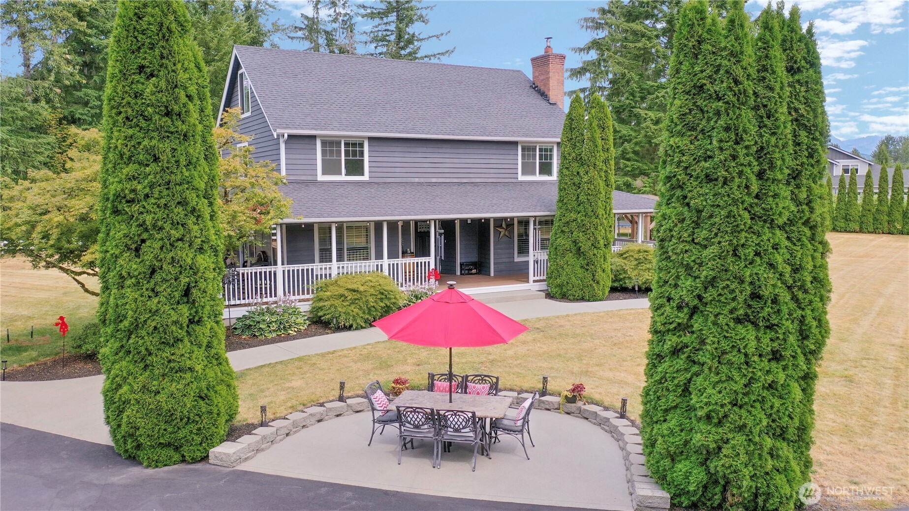 12523 Woods Lake Road Monroe, WA 98272 - Photo 2 of 40 an outdoor space with patio and outdoor seating