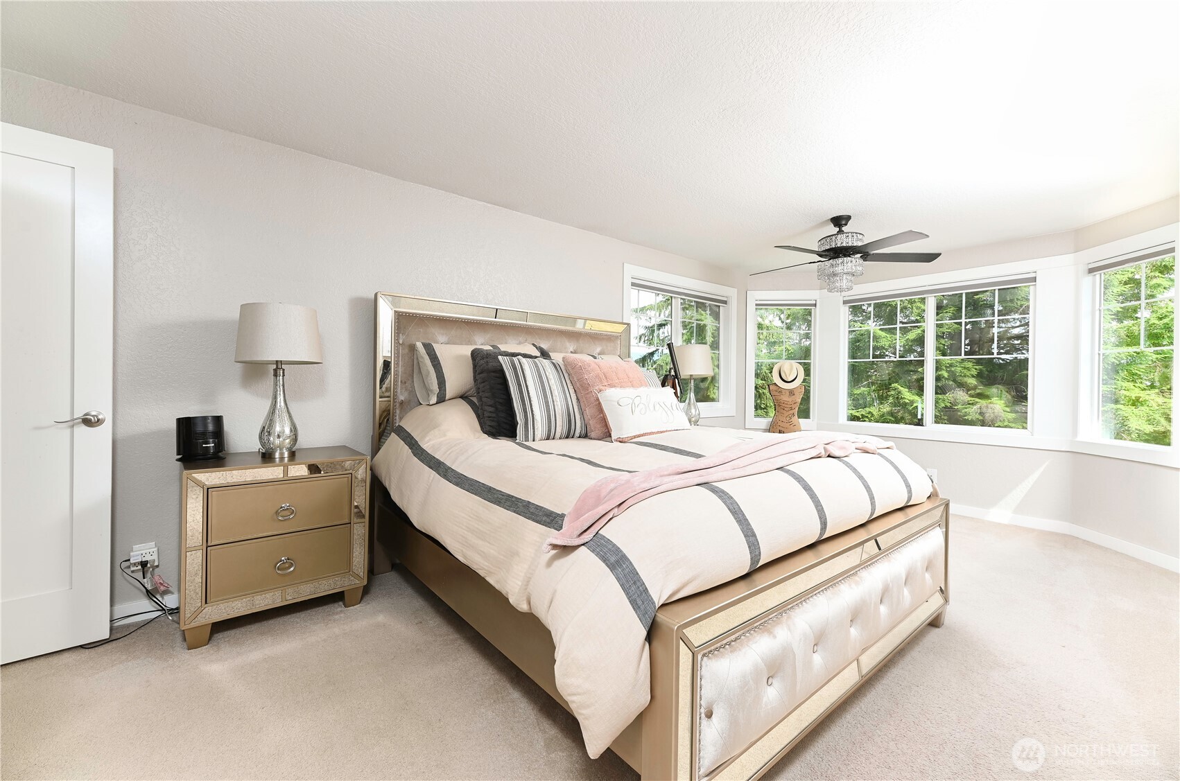 12523 Woods Lake Road Monroe, WA 98272 - Photo 21 of 40 a spacious bedroom with a bed and a large window