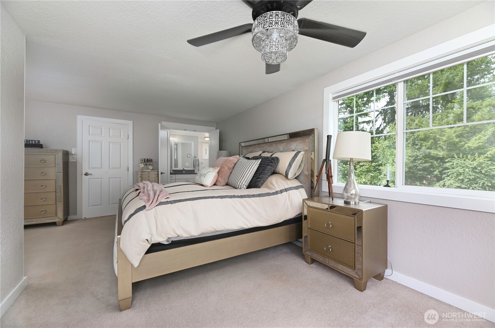 12523 Woods Lake Road Monroe, WA 98272 - Photo 22 of 40 a bed sitting in a spacious bedroom next to a window