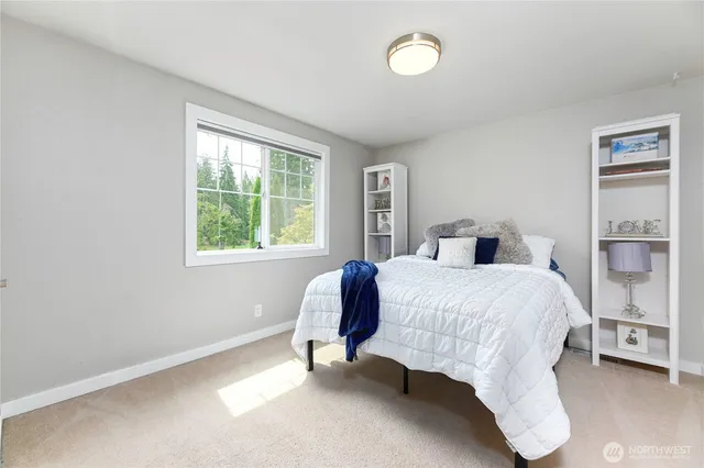 a bedroom with a bed and window