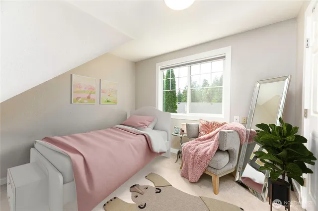 a bedroom with two beds and a potted plant