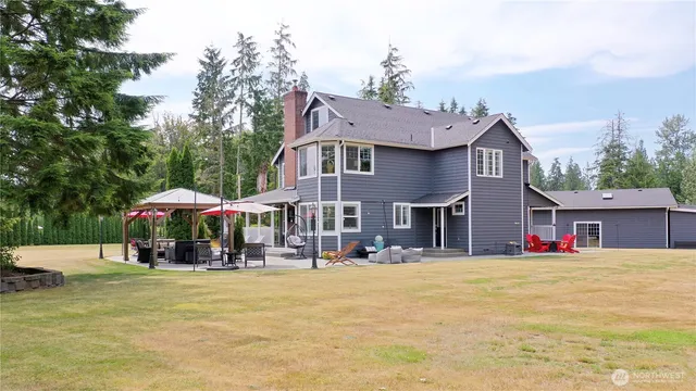a front view of house with outdoor seating