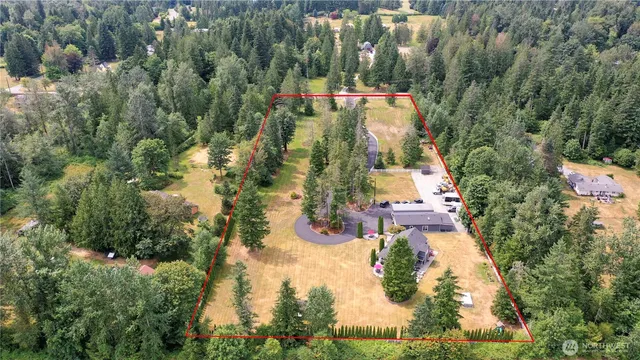 an aerial view of residential houses with trees