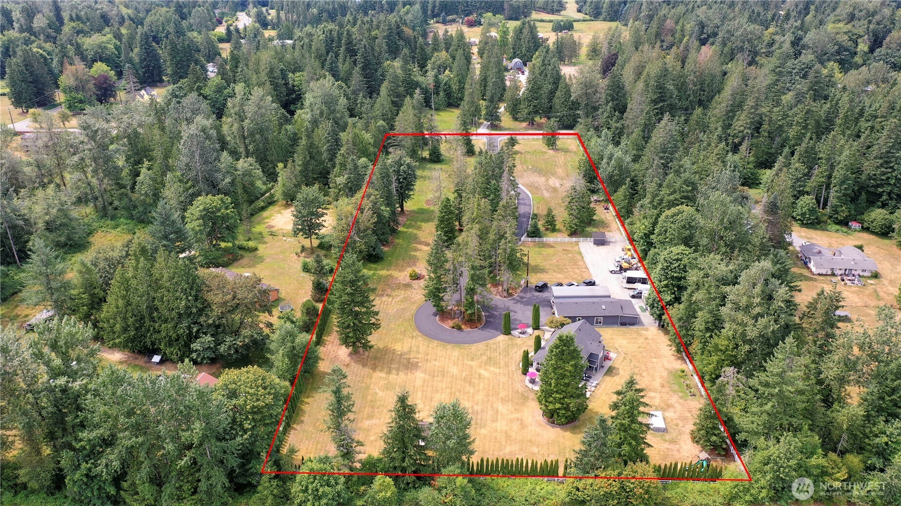 12523 Woods Lake Road Monroe, WA 98272 - Photo 4 of 40 an aerial view of residential houses with trees