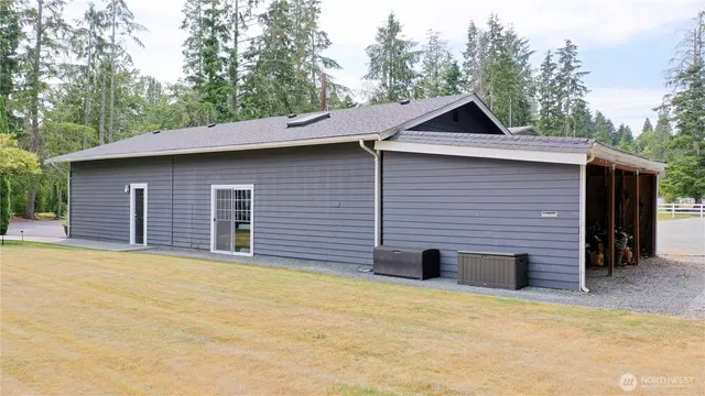 a backyard of a house with large trees
