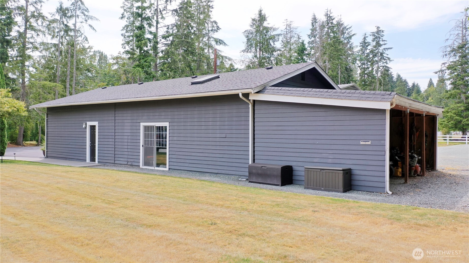 12523 Woods Lake Road Monroe, WA 98272 - Photo 6 of 40 a backyard of a house with large trees