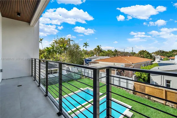 a view of a balcony with an ocean