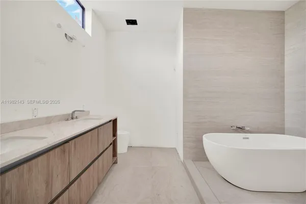 a bathroom with a bathtub and sink