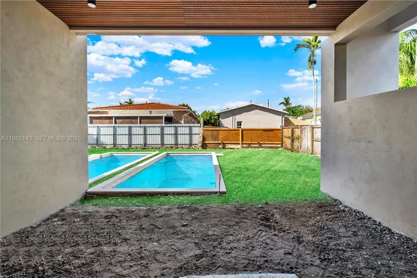 a view of swimming pool with a yard