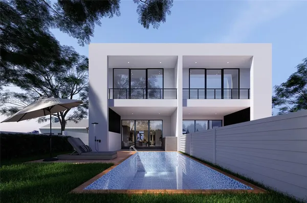 a view of a house with backyard porch and sitting area